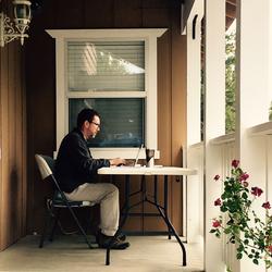 Graduate student typing on laptop